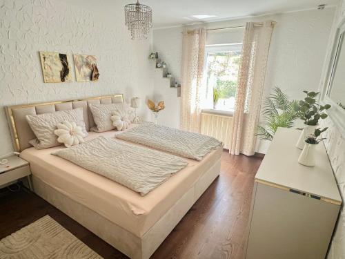a bedroom with a bed with flowers on it at Casparidyll in Sigmaringen