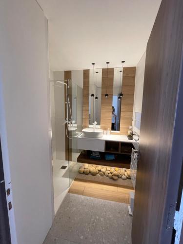 a bathroom with a sink and a mirror at Un balcon sur la mer in Nice