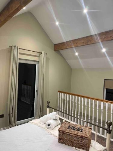 a bedroom with a bed with a large window at 86 Galgorm in Ballymena