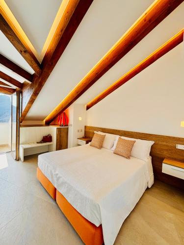 a bedroom with a large bed in a room at Le Perseidi in Agerola