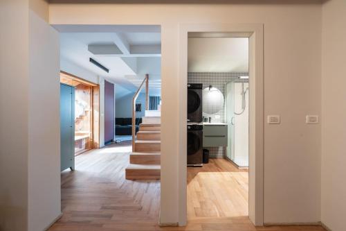 a hallway with a staircase in a house at Cesa del Volp in Canazei
