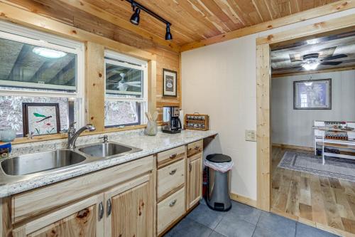 a kitchen with a sink and a window at Quaint Mountain Charm! Robbinsville Hideaway in Robbinsville
