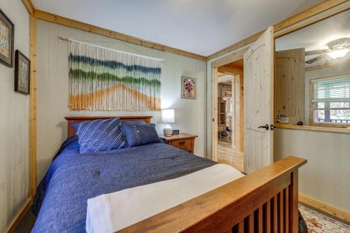 a bedroom with a bed with a wooden head board at Quaint Mountain Charm! Robbinsville Hideaway in Robbinsville