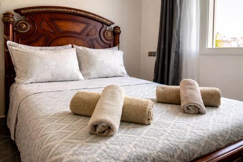 a bed with towels on top of it at Luxury Villa, 3 Levels, 5 bedrooms, 5 Baths, Pool & Garden in Tétouan