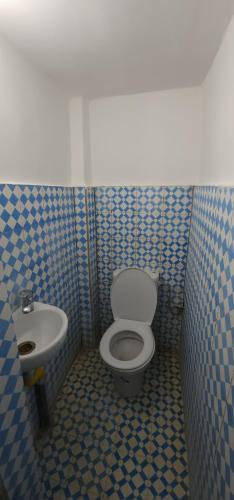 a bathroom with a toilet and a sink at Esc 6 3 9 in Fez