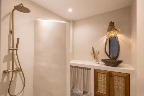 a bathroom with a shower and a mirror at Cavo Dio 1 - Beachfront bliss - Cozy Apt Pool Sunset in Káto Dhiminión