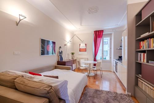 a bedroom with a couch and a table in a room at BM7-Design&Style in Milan