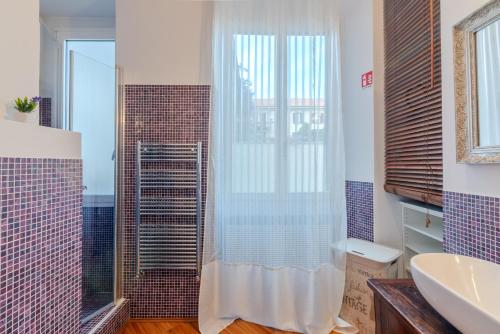 a bathroom with a shower and a sink at BM7-Design&Style in Milan