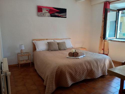a bedroom with a bed with two teddy bears on it at Romantic getaway on Lake Como in Brunate