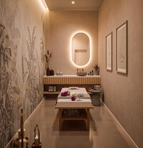 a bathroom with a sink and a table and a mirror at Crowne Plaza Istanbul West-Beylikduzu By IHG in Istanbul