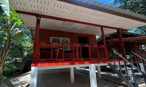a small house with a roof on top of it at Duangkeaw Simple House in Phra Ae beach