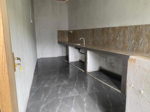 an empty room with a sink and a counter at Wild Wild Holiday in Kataragama