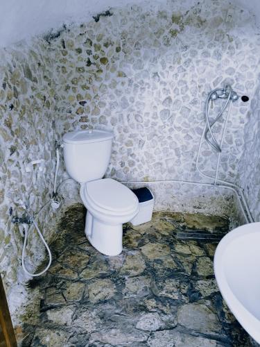 a bathroom with a toilet and a sink at Diar twins in Gabès