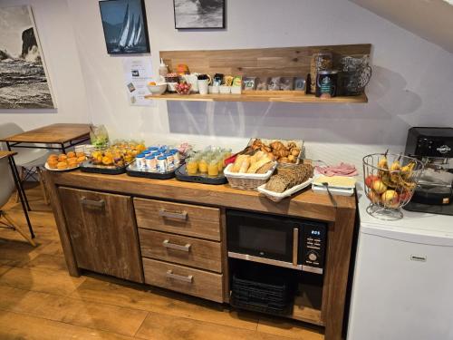 a table with a buffet of food on it at Hotel Saint Amant in Le Palais