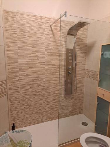 a shower with a glass door in a bathroom at Campania Home in Terni
