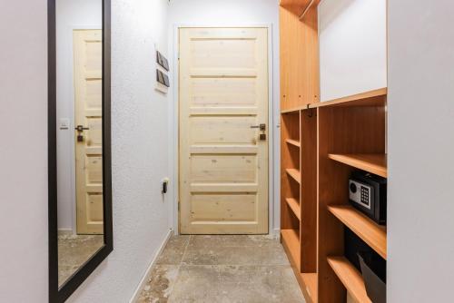 a mirror in a small room with a door at Boutique Suite 02 Chic in Zadar