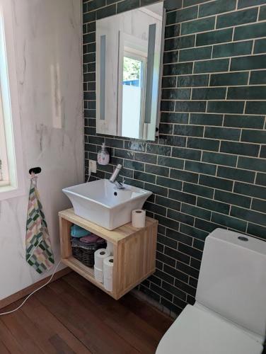 a bathroom with a sink and a toilet at Rasteplassen in Stordalen