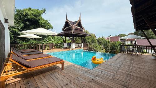 a swimming pool with a rubber duck in the middle at Private Pool 4BR Villa with Sea View Sleeps 8 in Mae Pim