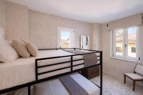 a bedroom with a bunk bed with a window at Sant'Agostino in Pizzo