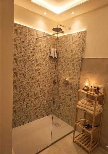 a shower with a glass door in a bathroom at Casa Asprigna in Ficarazzi