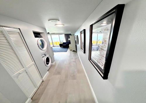 a hallway of a house with a washer and dryer at Just Updated Wyndham Ocean Walk Resort Daytona Beach 1606 One Bedroom Resort Condo Oceanfront in Daytona Beach