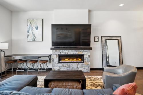 a living room with a couch and a fireplace at Downtown Gem in Whitefish