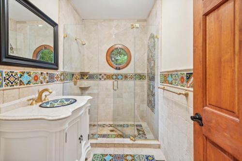 a bathroom with a sink and a shower at Hamptons Romantic Waterfront Queen Suite in Remsenburg