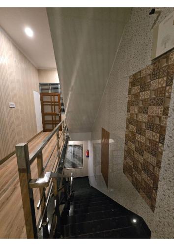 a staircase in a building with a stair case at SHREE RAMA Niwasam in Ayodhya