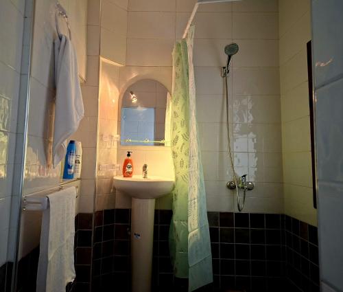 a bathroom with a sink and a shower at Casa Si Ahmed in Chefchaouen
