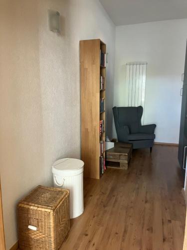 a living room with a couch and a chair at Alte Gärtnerei in Blankenburg