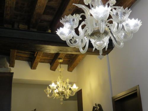 a chandelier hanging from a ceiling in a room at Hotel Bridge in Venice