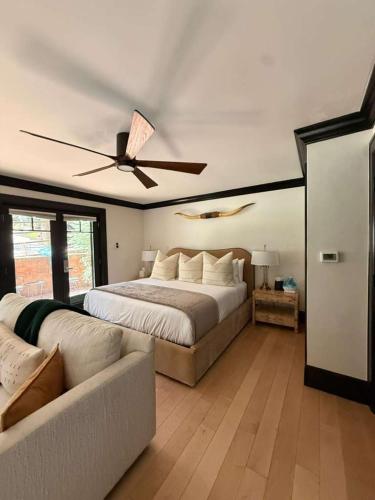 a bedroom with a bed and a ceiling fan at Spacious 3 & 3 in Aspen's Core with Sauna in Aspen