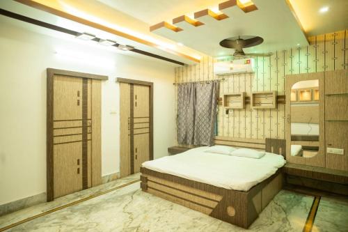 a bedroom with a bed in a room at The Tulsi Enclave Riverside in Agartala