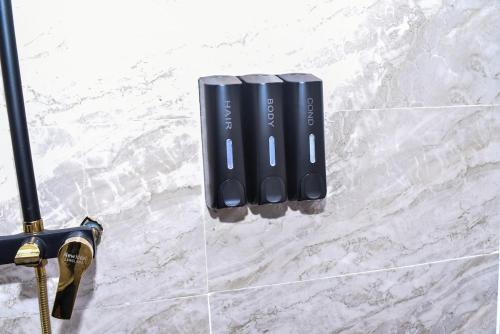 a pair of black batteries sitting on a counter at Skye Palace Apartment - Ambassador Suite in Akure