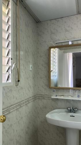 a bathroom with a sink and a mirror at Hotel Congra in Pilar de la Horadada