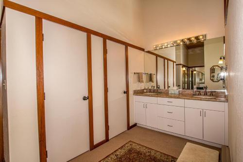 a bathroom with two sinks and a large mirror at Star Harbor # 13 By Hauserman Rentals in Tahoe City
