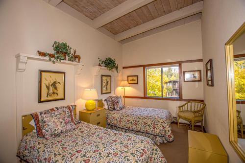 a bedroom with two beds and a window at Star Harbor # 13 By Hauserman Rentals in Tahoe City