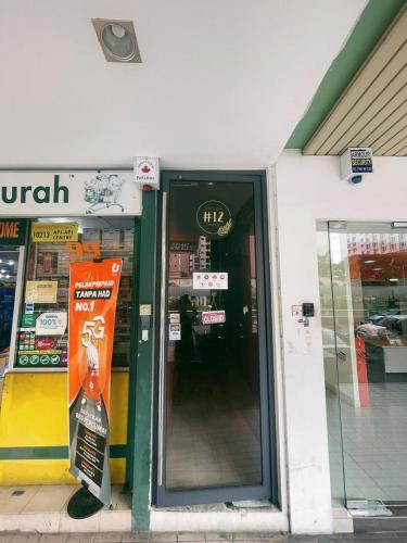 an entrance to a store with a sign in the doorway at BlackView in Kota Kinabalu
