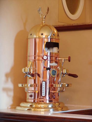 a golden robot sitting on top of a counter at Castello Montegiove in Fano