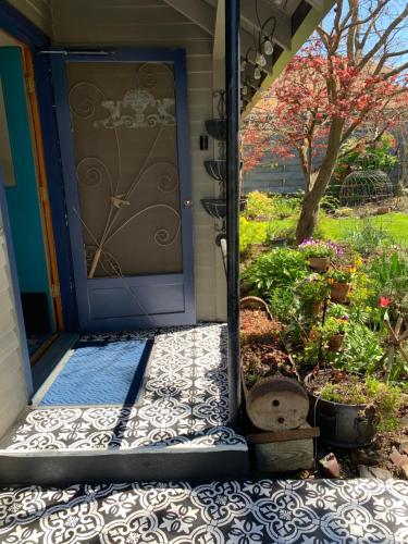 a front door of a house with a garden at Riverhouse Hidden Gem in The Dalles