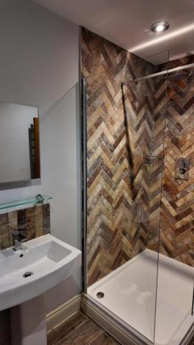a bathroom with a sink and a shower at The Gregory Arms in Harlaxton
