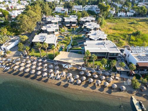 an aerial view of a resort with umbrellas at Luxurious Villa Private Pool Private Beach Views in Bodrum City