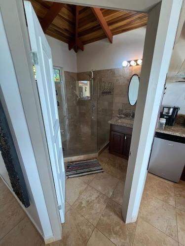 a bathroom with a shower and a sink at Ballena Bay Villa Lot 45 Villa del Mar in Tambor