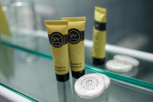 a glass counter with two tubes of sunscreen on it at Hotel Kastoria in Kastoria City in Kastoria