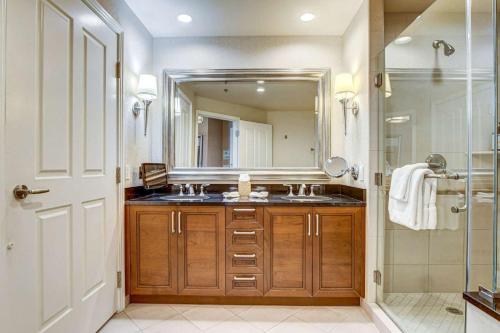 a bathroom with a sink and a mirror at The Signature MGM Las Vegas in Las Vegas
