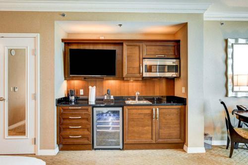 a kitchen with a sink and a microwave at The Signature MGM Las Vegas in Las Vegas