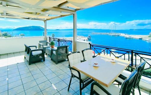 a balcony with a table and chairs and the ocean at Anna Maria - Vanessa Apartments in Neo Klima