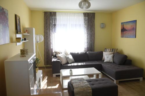 a living room with a couch and a table at Prestige in Šabac