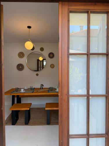 a bathroom with a sink and a mirror at Villa Vittoria in Lignano Sabbiadoro