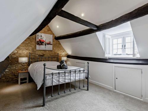 a bedroom with a bed in a attic at 3 Bed in Witney oc-82478 in Hailey